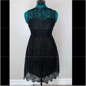 black lace illusion neckline midi dress
